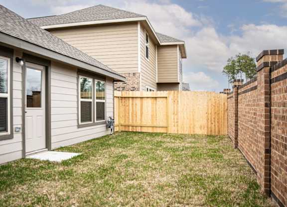 Luxury Homes for Rent in Humble TX - Edgewater at the Lagoon - Backyard with Grass