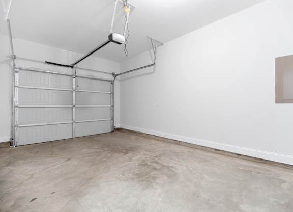 Cottonvale Towns in Savannah, GA photo of the interior of a garage with white walls and a garage door