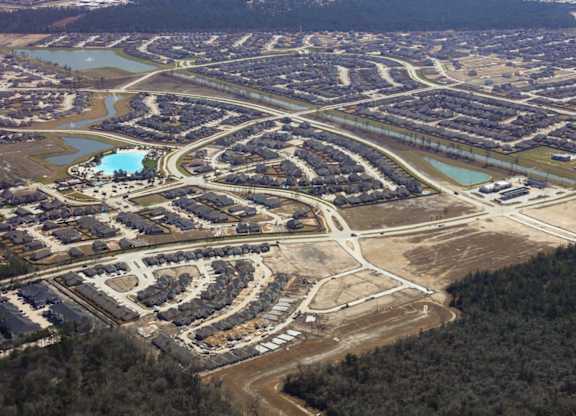 an aerial view of a city with a river in the middle of it