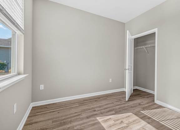 A room with a door and a window.