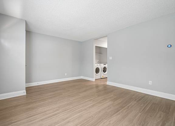 A room with a washer and dryer in it.