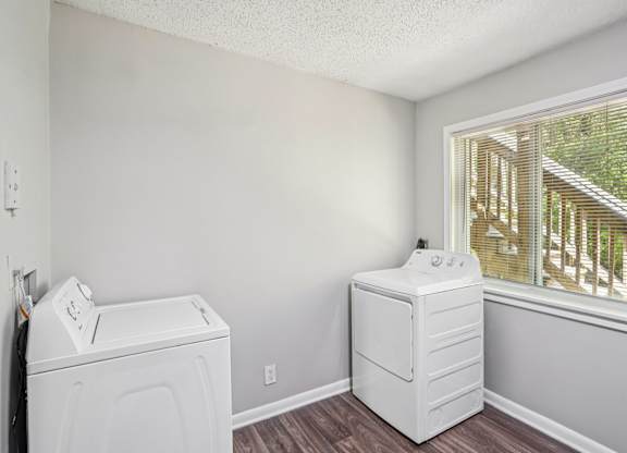 A laundry room with a washer and dryer.