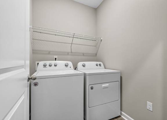 A laundry room with a washer and dryer.