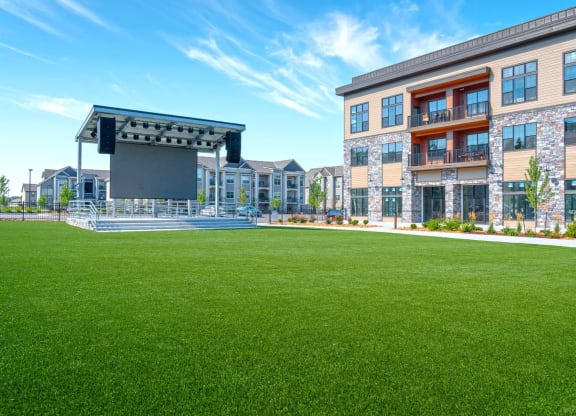 a lawn in front of a building with a lawn amphitheater