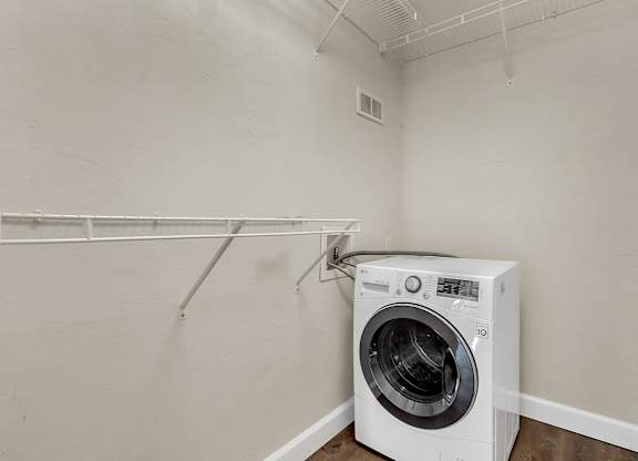 Addison Lane Apartment homes in Gainesville Florida photo of photo of a laundry room with a washer and dryer