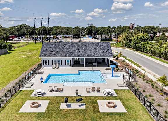 A large house with a pool in the backyard.