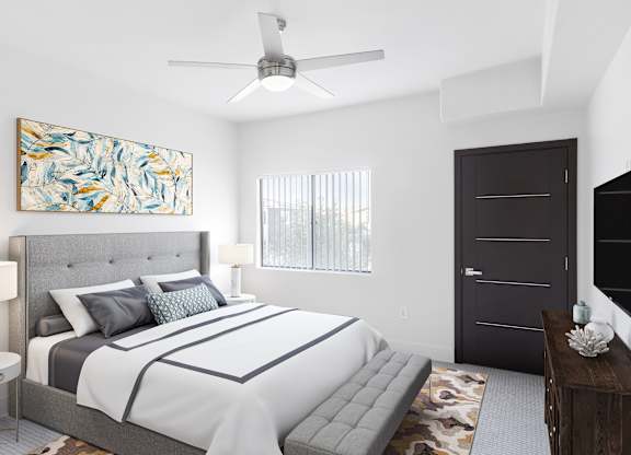 A bedroom with a large bed and a painting on the wall.