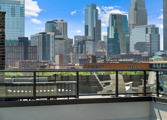 the view of the city from the rooftop deck of a building