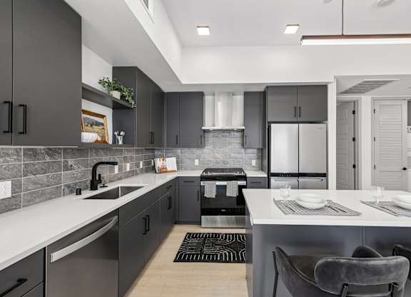 A modern kitchen with a dining area.