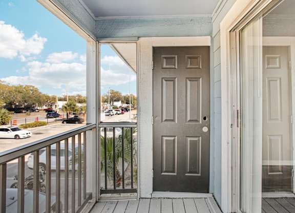 A grey door is on the left and a white door is on the right.