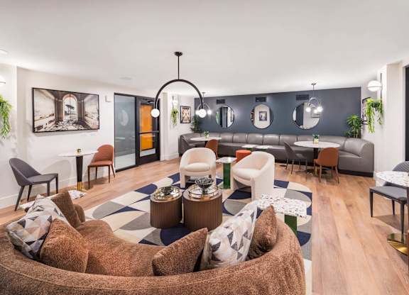 A modern living room with a large couch and a coffee table.