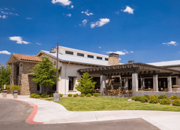 A large building with a covered patio area.