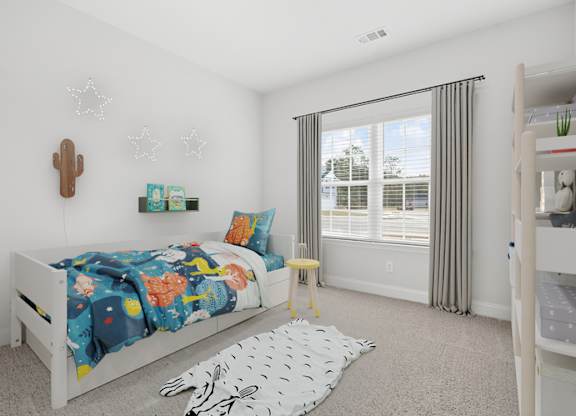 Harris Trail Luxury Townhomes for rent Richmond Hill, GA photo of a bedroom with a bed and a large window