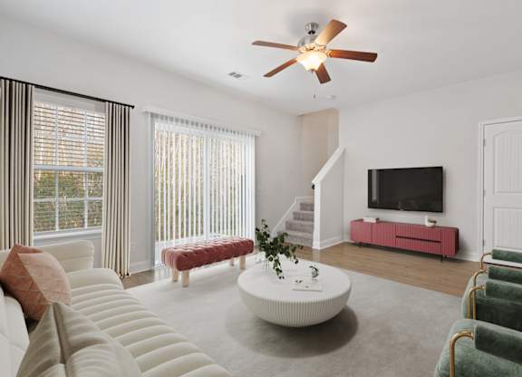 Harris Trail Luxury Townhomes for rent Richmond Hill, GA photo of a living room with a couch and a coffee table