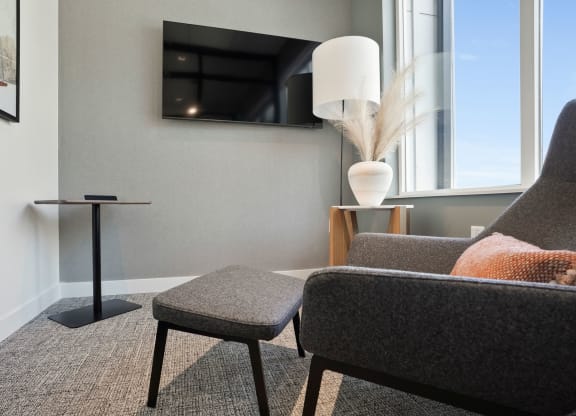 a living room with a couch and a chair