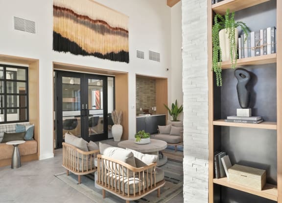 a living room filled with furniture and a large window