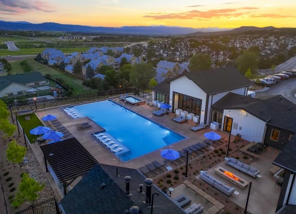 an aerial view of the pool at sunset at the resort at governors crossing
