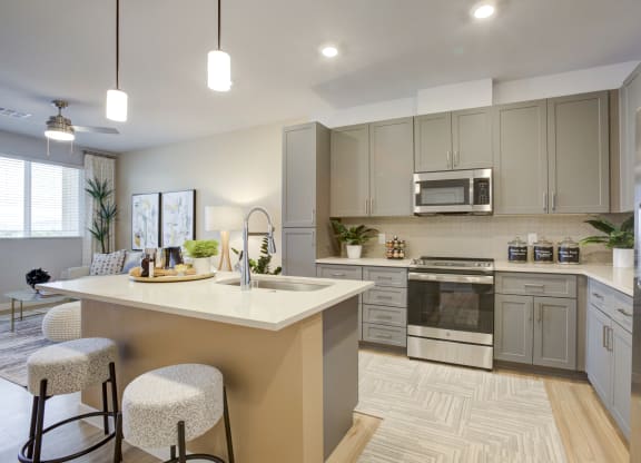 South Scottsdale Apartments - Lucent Scottsdale - Luxury Kitchen with Quartz countertops with undermount sinks and ceramic tile backsplash.