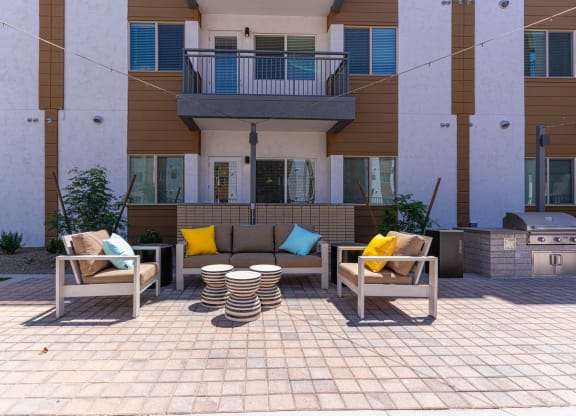 South Scottsdale, AZ Apartments - Lucent Scottsdale - Sparkling Pool With Tanning Ledge, Cabanas, Lounge Chairs, Tables, And Umbrellas
