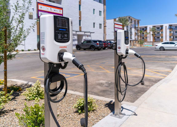 Pet-Friendly Apartments In South Scottsdale, AZ - Lucent Scottsdale - two electric charging stations on the side of a street