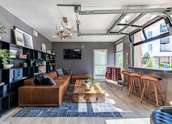 a living room with a brown couch and a coffee table