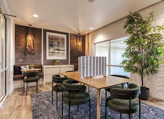 a dining room with a table and chairs