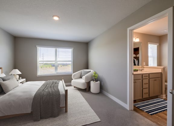 a bedroom with a bed and a chair and a mirror