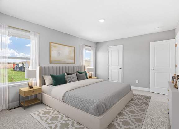 A bedroom with a large bed and a painting on the wall.