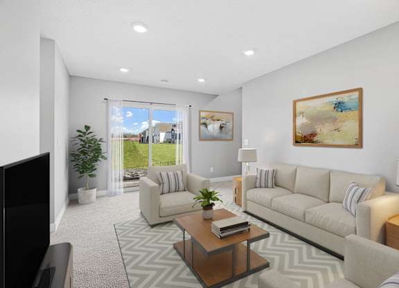 A living room with a couch, chair, and television.
