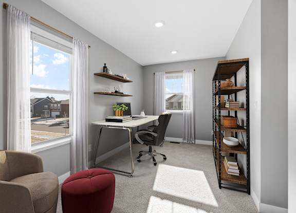 A modern home office with a desk, chair, and shelves.