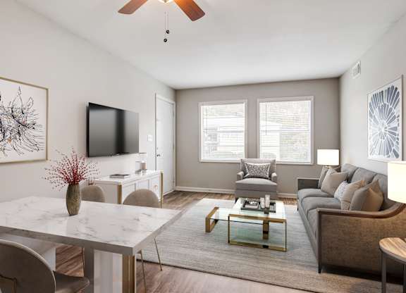 Spacious living room with large windows at Brookview apartments in Douglasville, Georgia near Atlanta-Sandy Springs-Roswell metro area