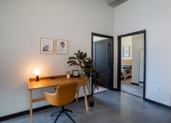a home office with a desk and chair