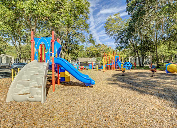 Spacious outdoor playground area at Chelsea Apartments in Gainesville, FL