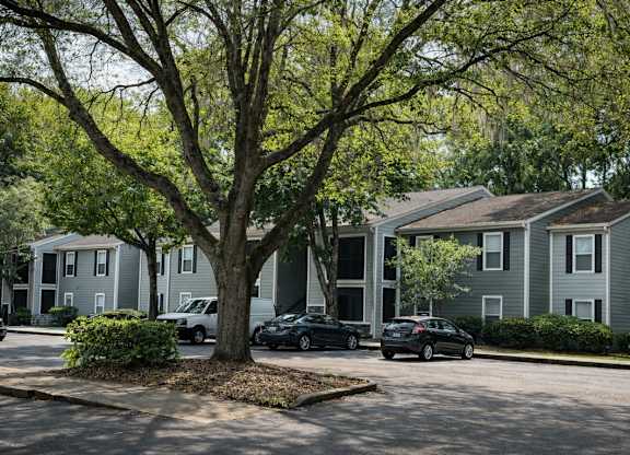 Apartment homes surrounded by mature trees at Chelsea Apartments in Gainesville, FL