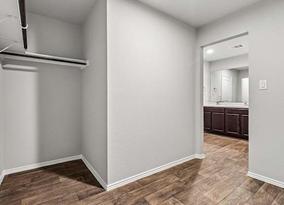 A room with a wooden floor and white walls.