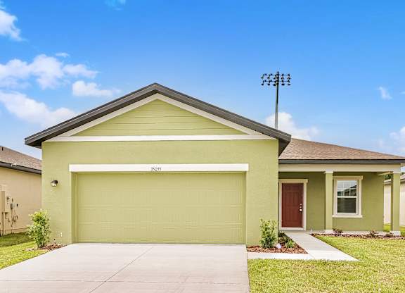 A house with a garage door that says