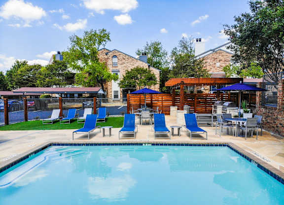 cottages at wells branch  pool with poolside loungers