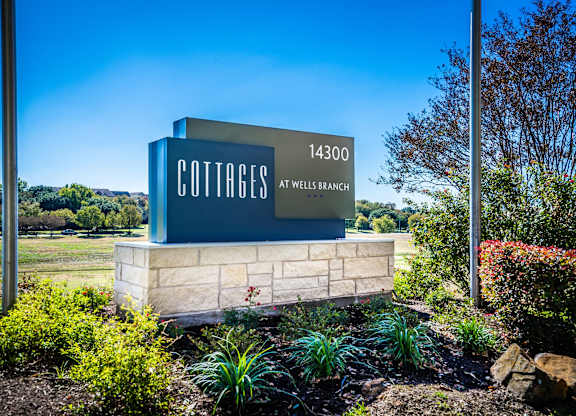 cottages at wells branch  main entrance sign