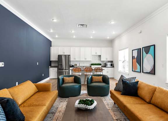 A modern living room with a yellow sofa and a wooden coffee table.