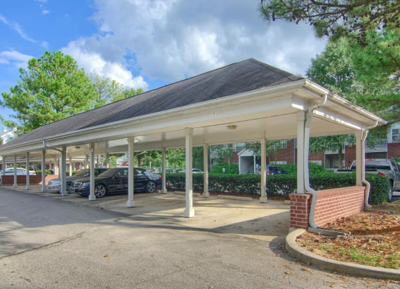 Enclave at Wolfchase Apartments in Cordova Tennessee photo of a covered parking lot with cars parked under it
