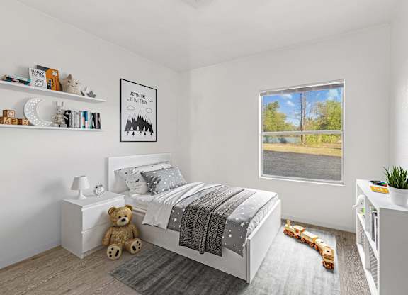 Bedroom with large window at Huntington Meadows Apartments in Austin, TX 78724
