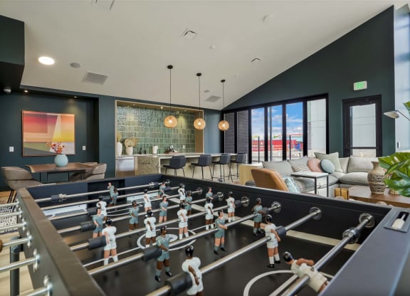 a game room with a foosball table