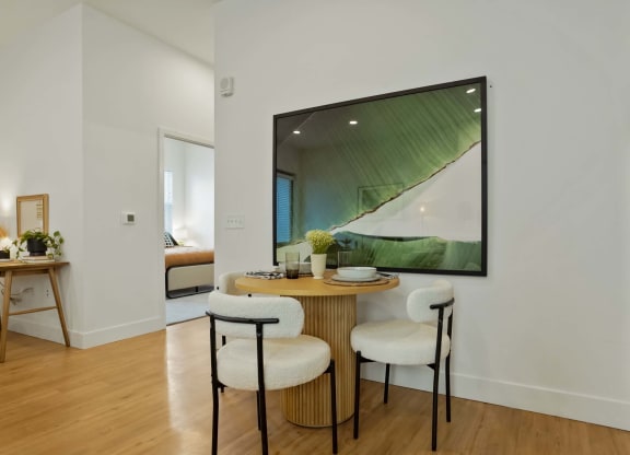 a dining room with a table and chairs