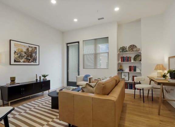 a living room with a couch and a table