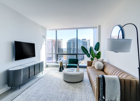 a living room with a couch and a large window