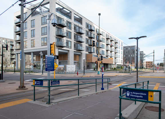 A street view of a city with a sign that reads