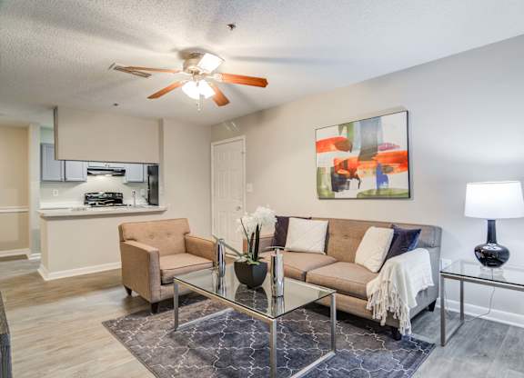 Spacious living room with modern design at Flats at River View apartments in Duluth, GA, near Lawrenceville.