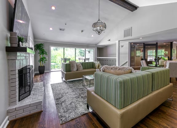 a living room with couches and a fireplace