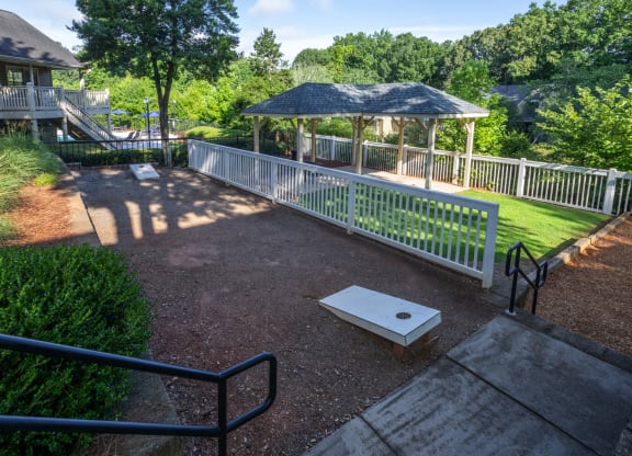 a gazebo in a park next to a house