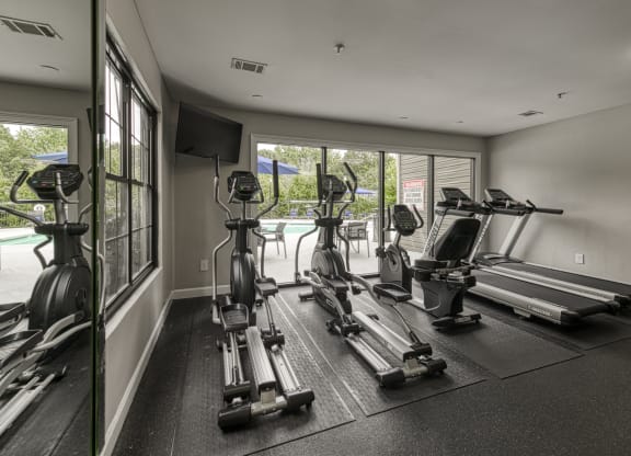 the gym is equipped with cardio equipment and treadmills